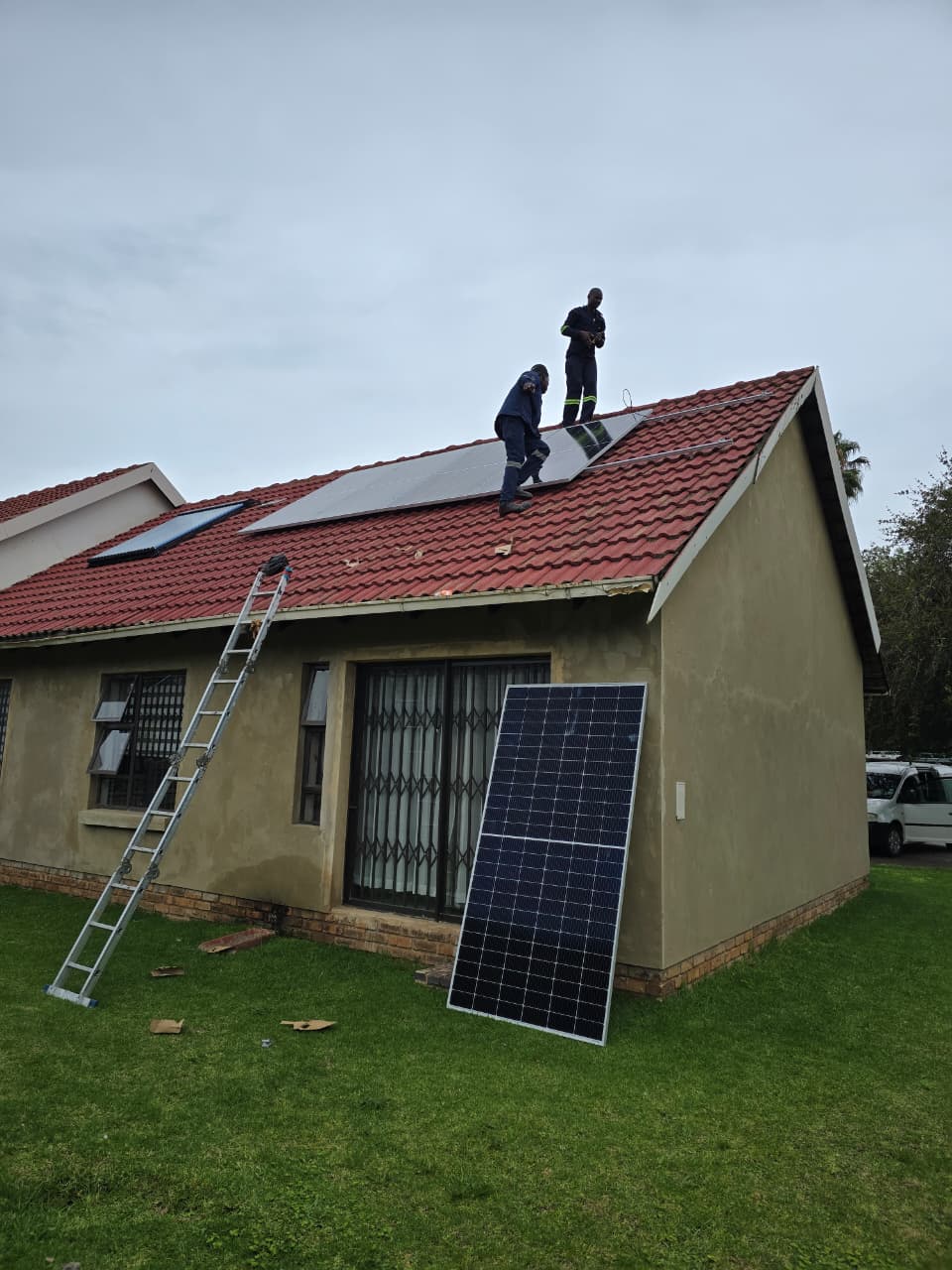 Roof panel installation team